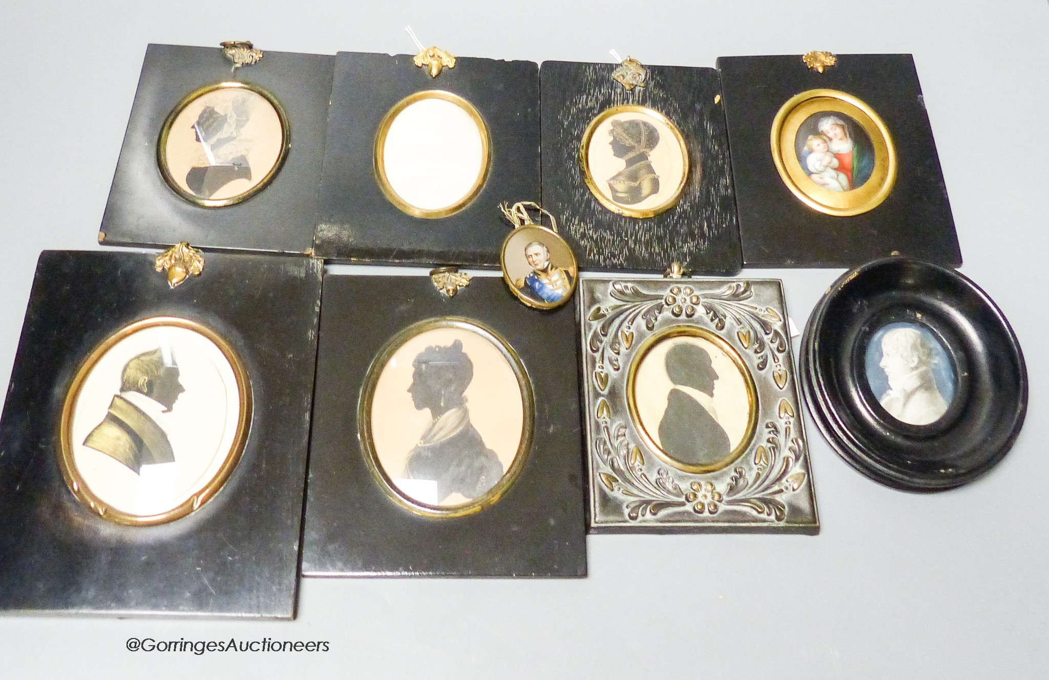 A 19th century portrait miniature, Madonna and child, together with five assorted silhouette portraits and two portraits (8)